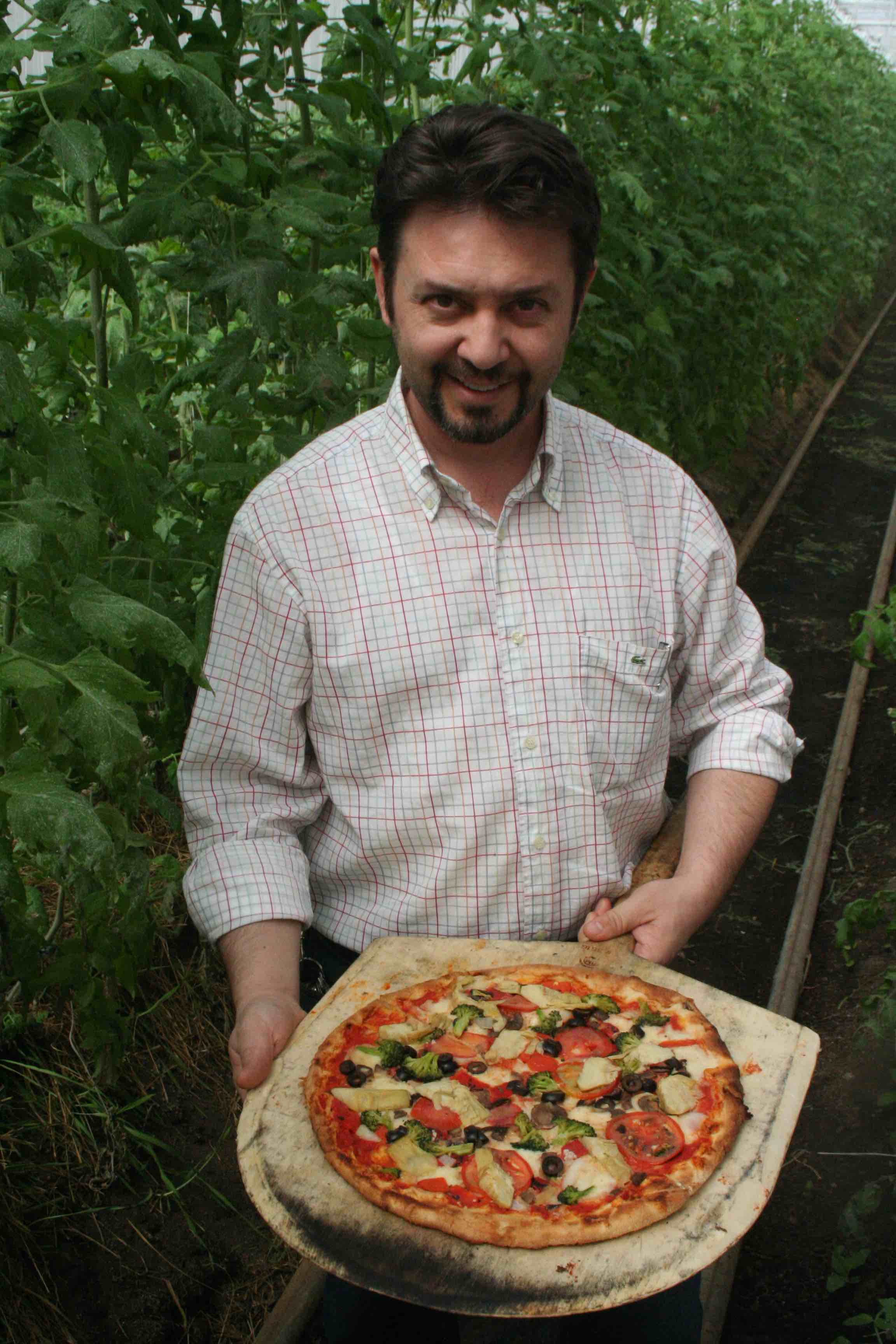 my pizza man3 standing in organic indoor tomato grove.jpg